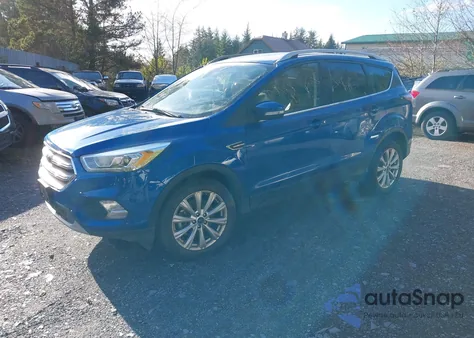 2017 Ford Escape Titanium z USA, uszkodzony, nr VIN 1FMCU9J93HUC02916